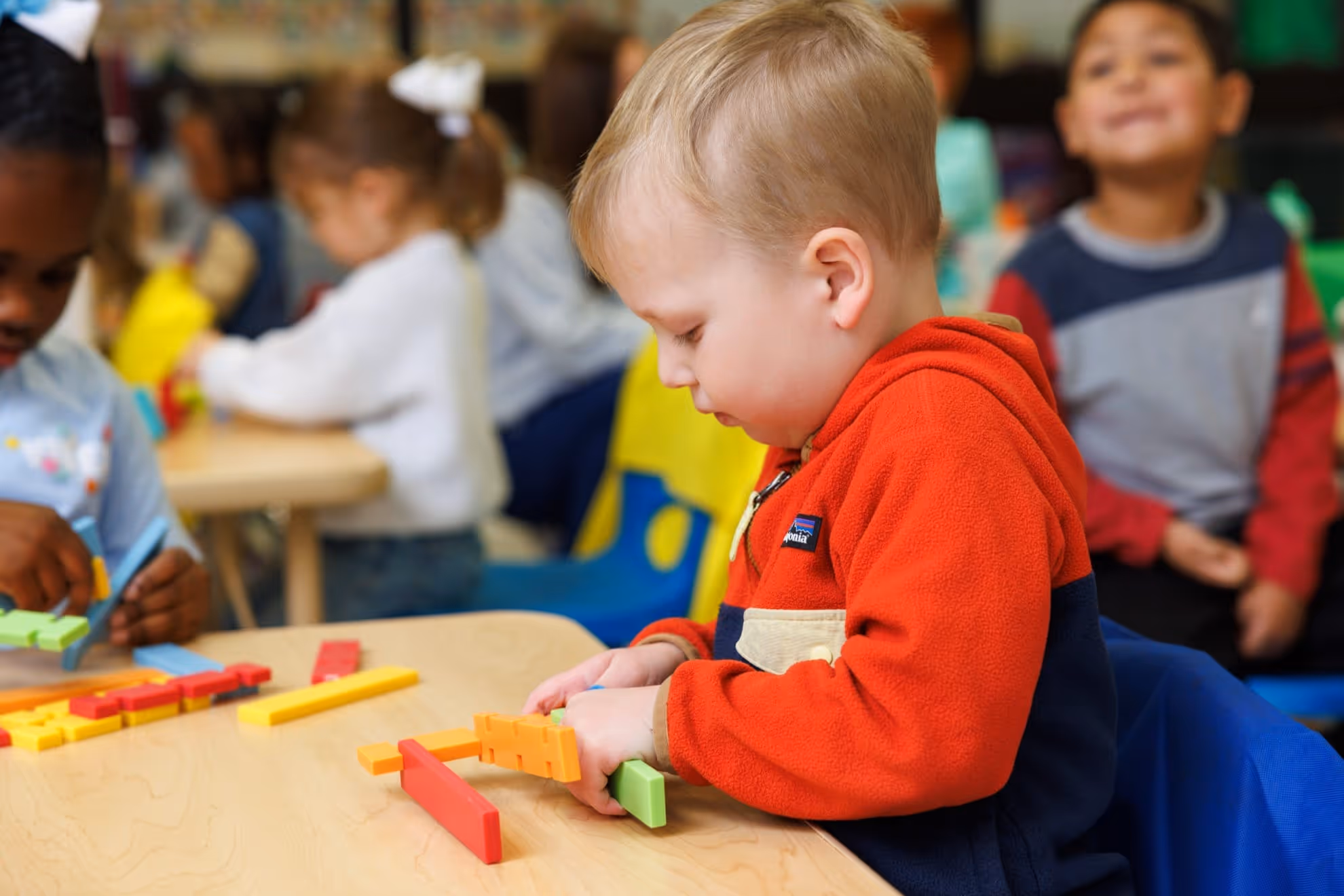 Child playing with building toys