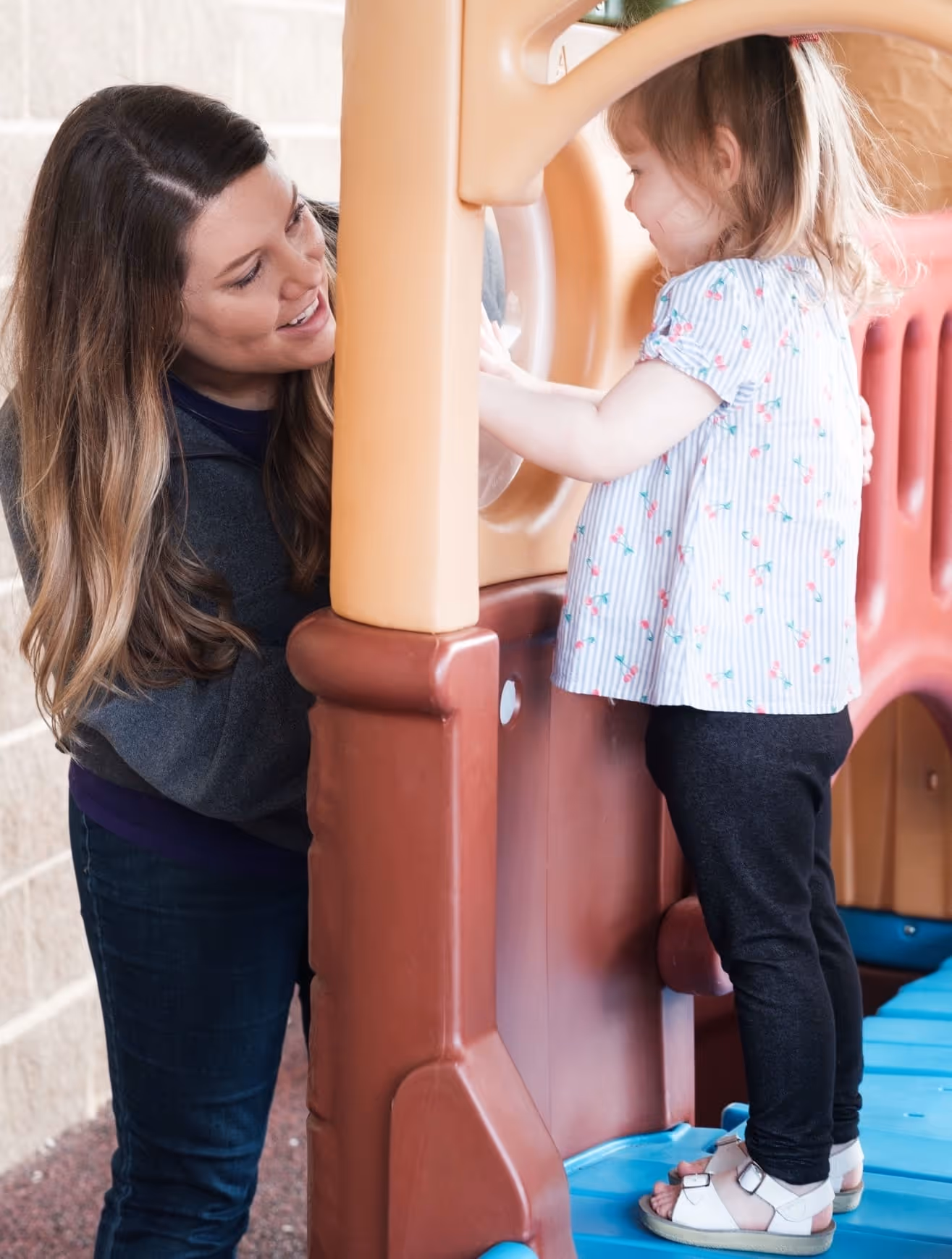 BIG staff member playing with a child