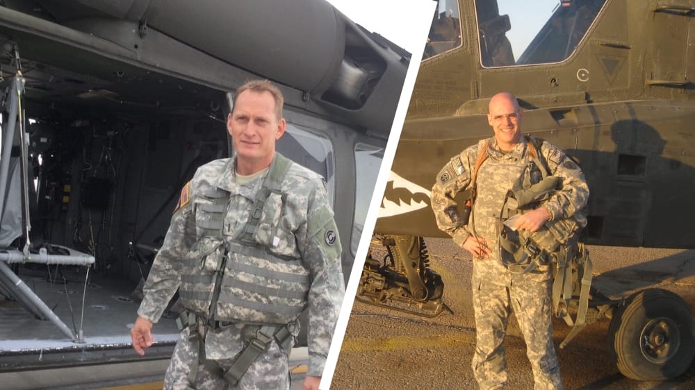 Two soldiers in military uniforms, one standing near a helicopter and the other posed beside it.