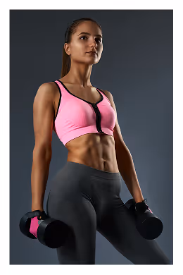 Athletic woman in a pink sports bra and gray leggings holding black and pink dumbbells.