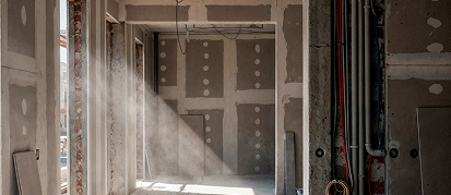 Interior drywall installation showing framing and finishing