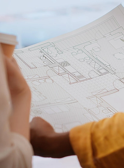 Engineer reviewing blueprints during pre-construction planning