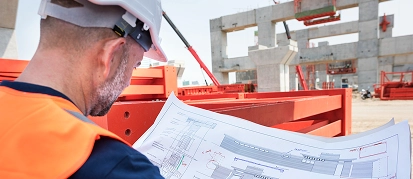 Supervisor coordinating work at a commercial construction site