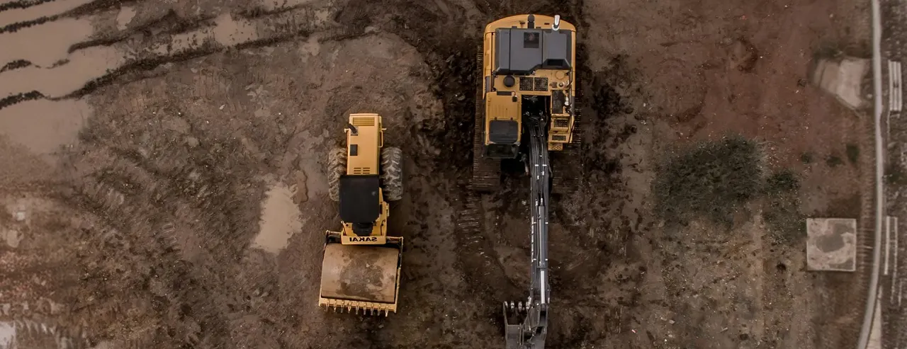Overhead shot of excavators on a live construction site
