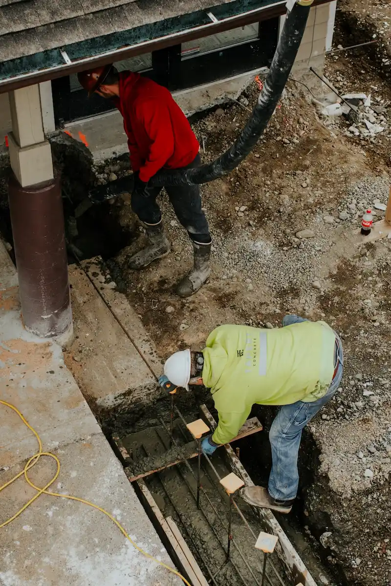 Workers repairing a foundation