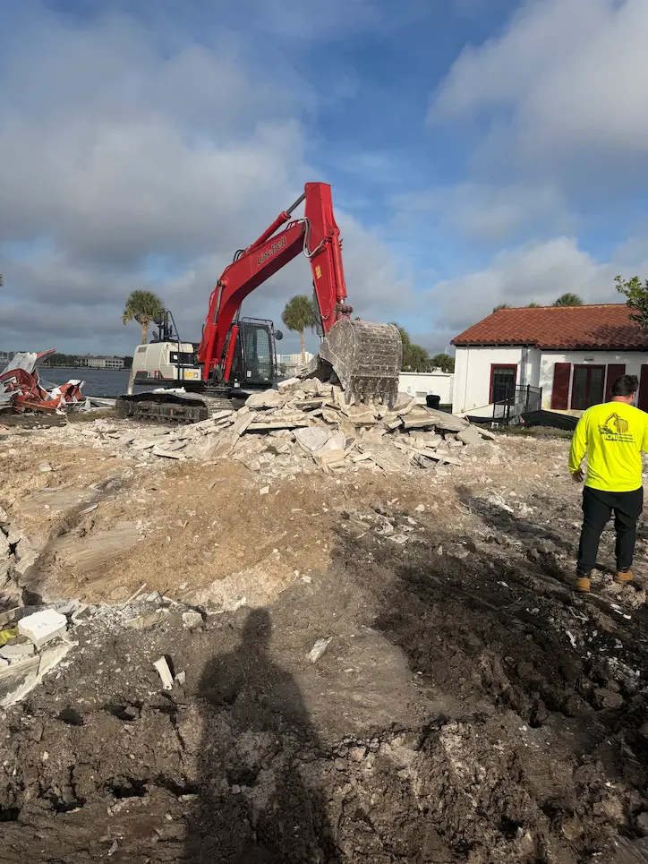 A red excavator on a live construction site