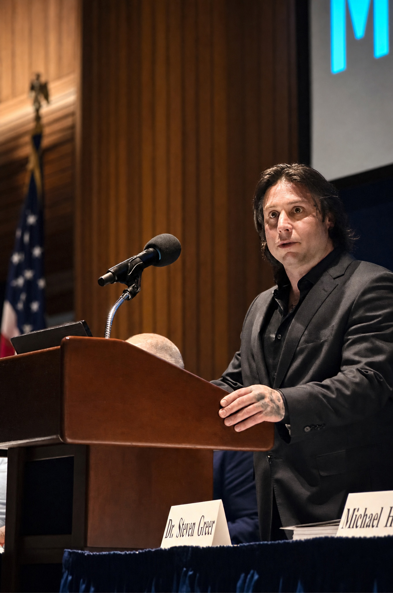 psionic-asset-team-member-speaking-at-a-podium