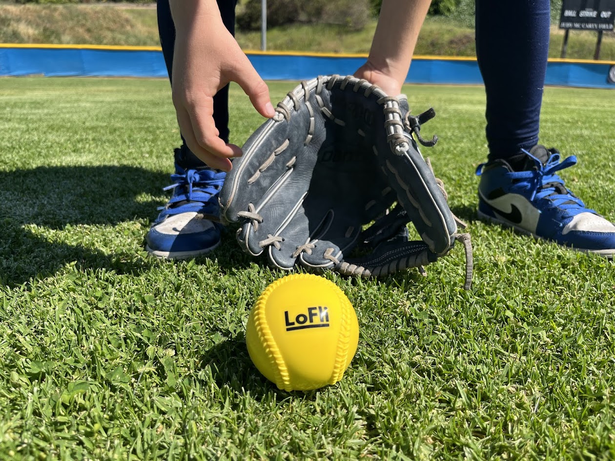 LoFli ball being fielded by a young player