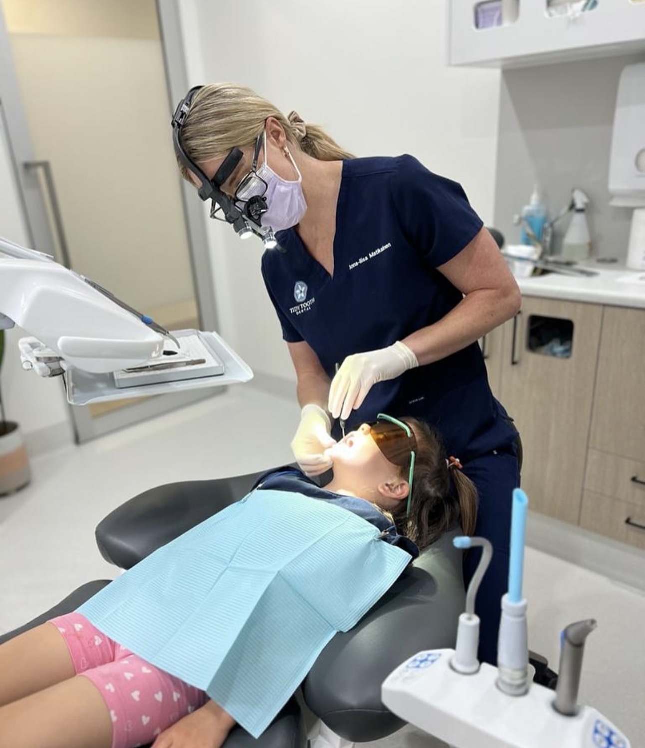 Oral health therapist performing a professional dental clean at Tidy Tooth Dental