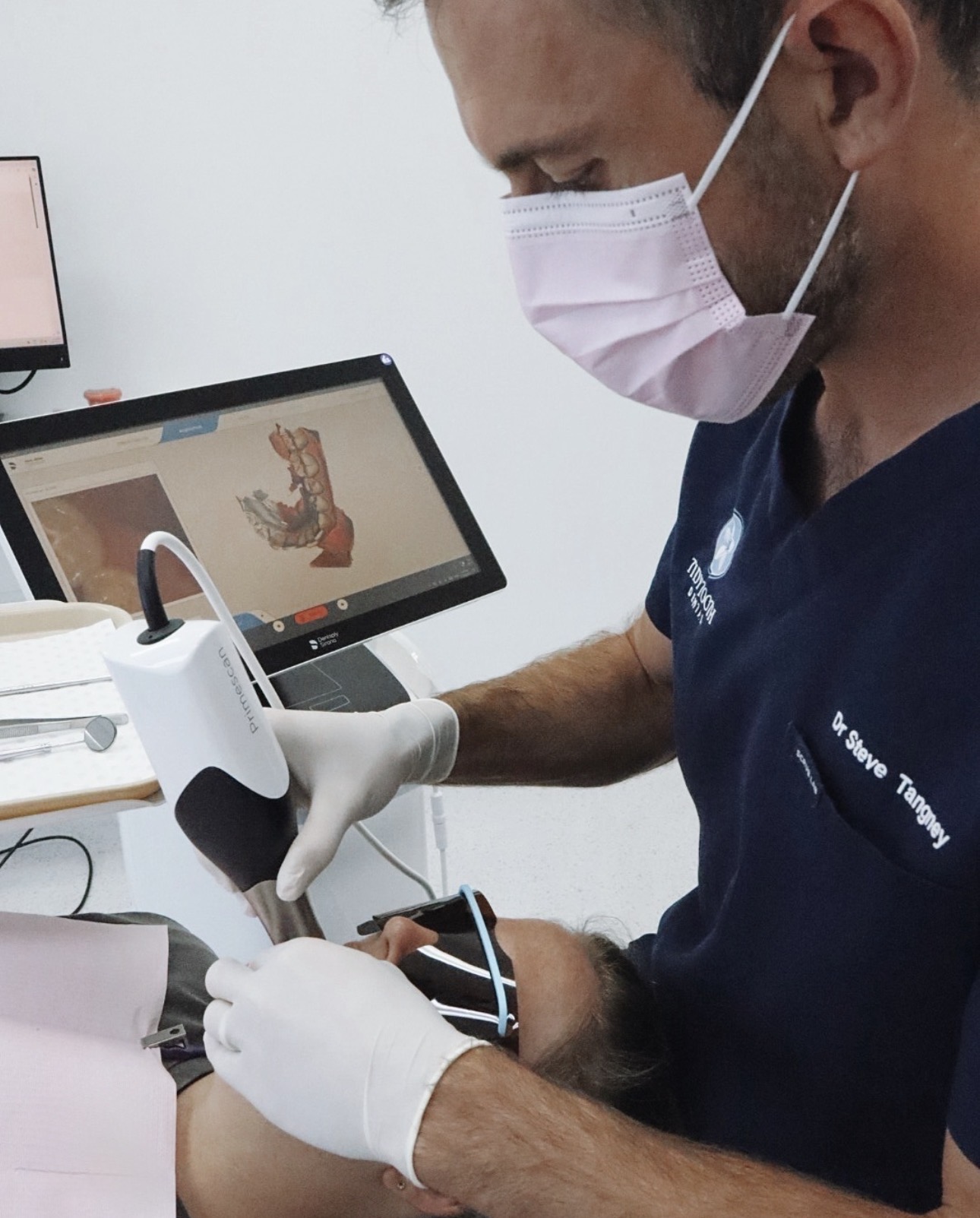 Dr Steve Tangney taking a digital scan of a patient's teeth with the Primescan intraoral scanner