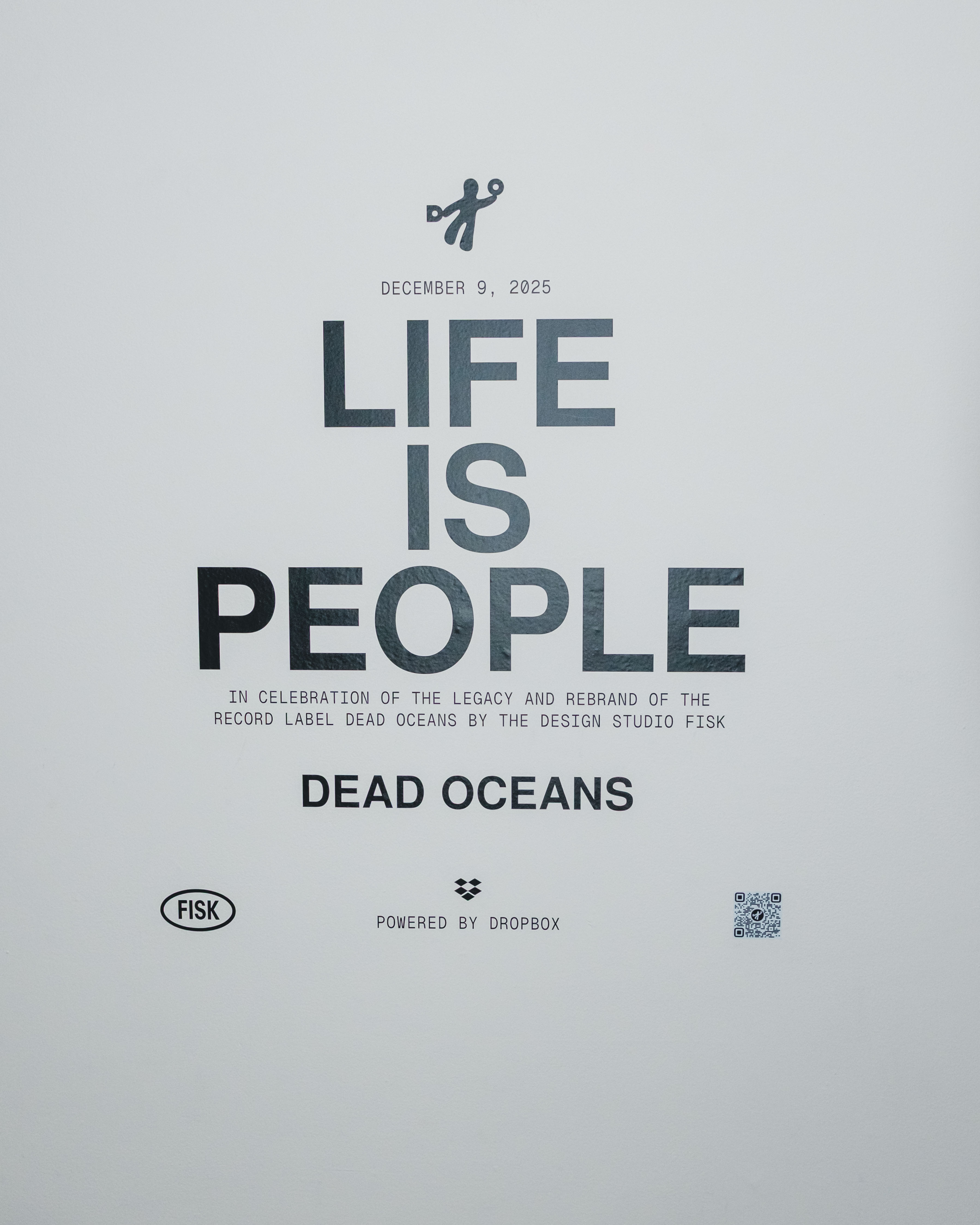 Poster with a white background and large dark text reading “LIFE IS PEOPLE.”