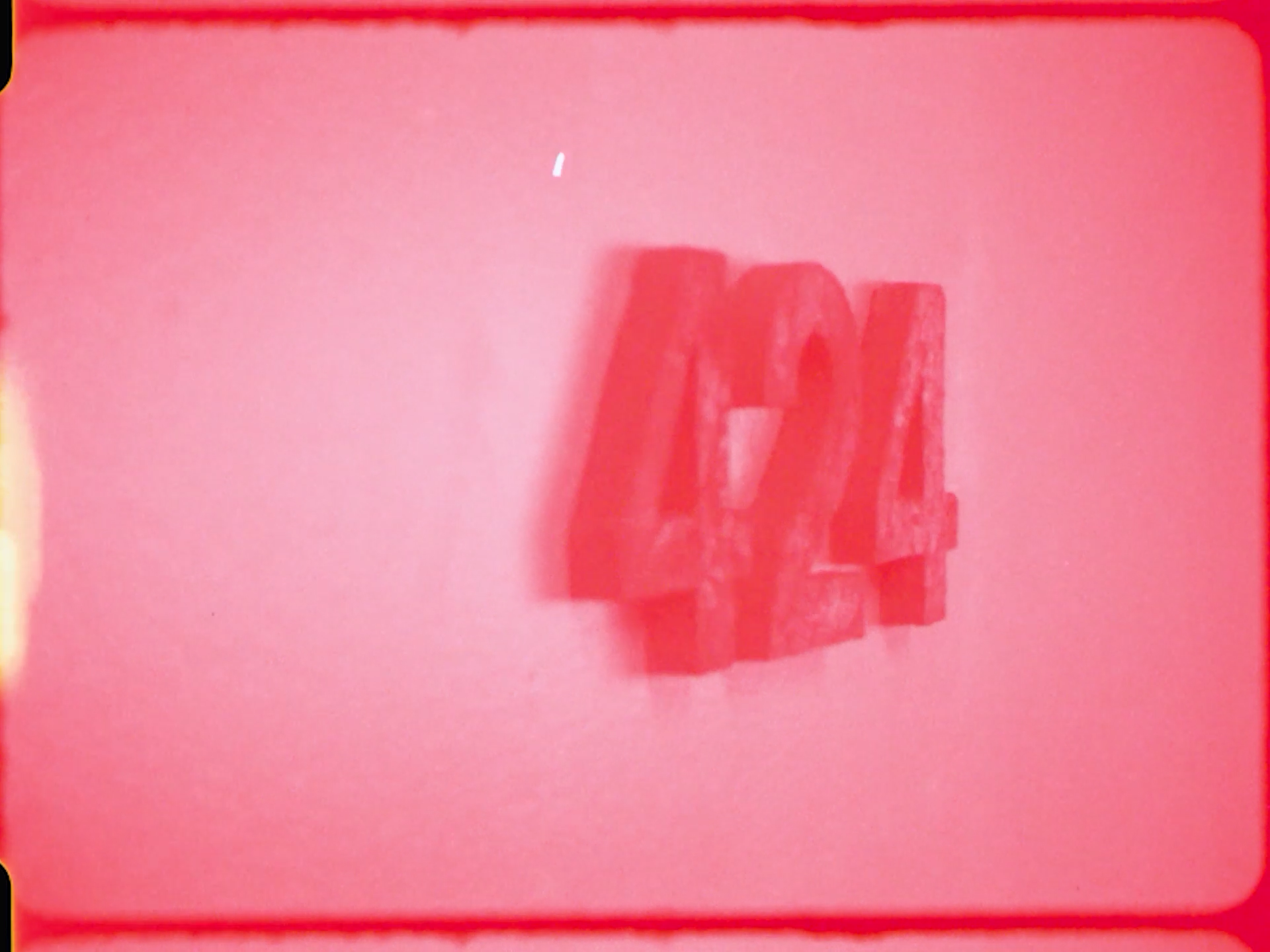 Red “424” numerals mounted on a pale pink wall