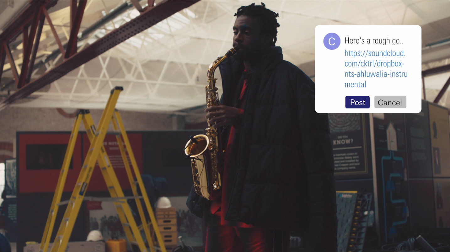 Blurred person holding a saxophone in a museum with a social media comment popup.