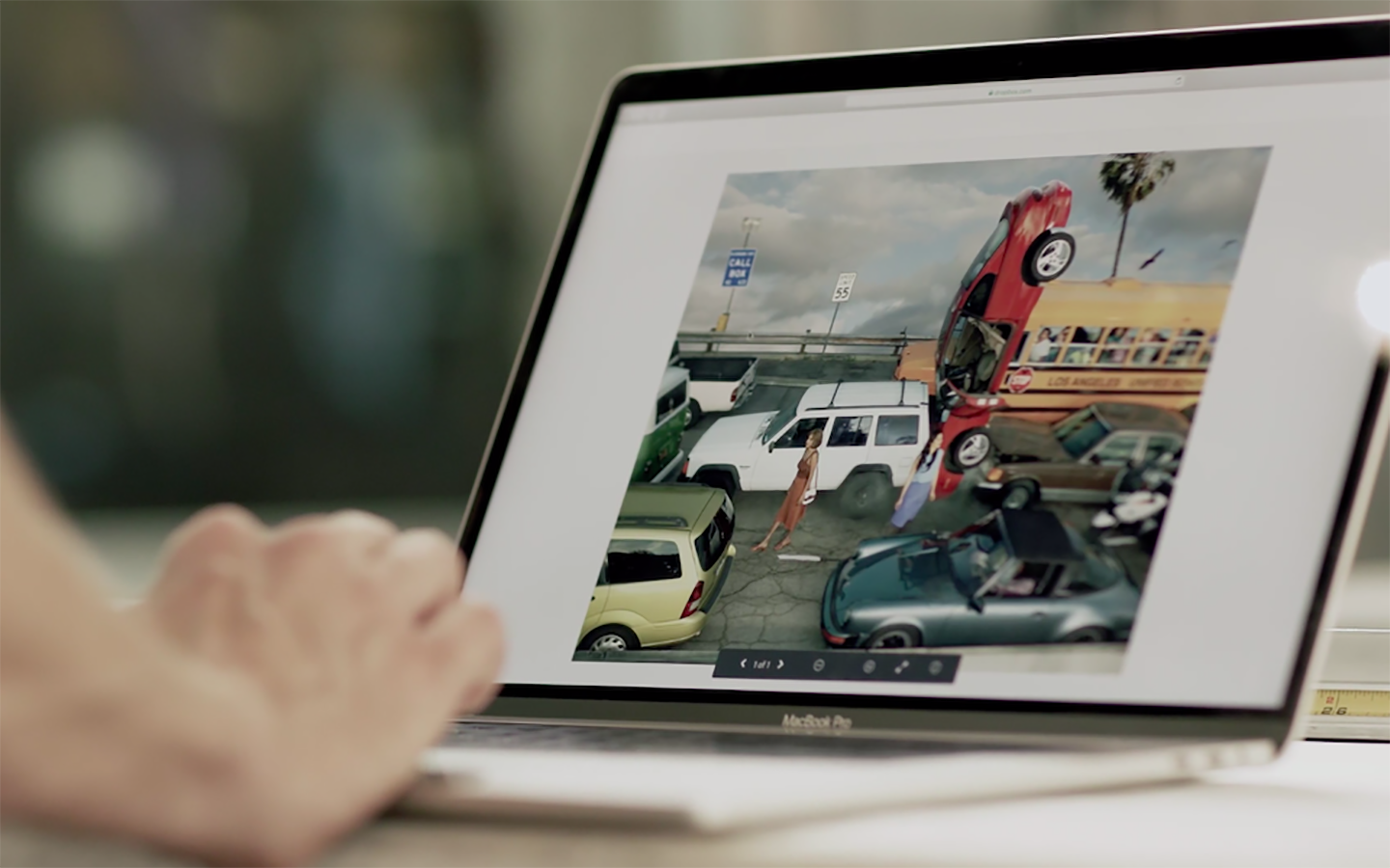 Person viewing a laptop screen.