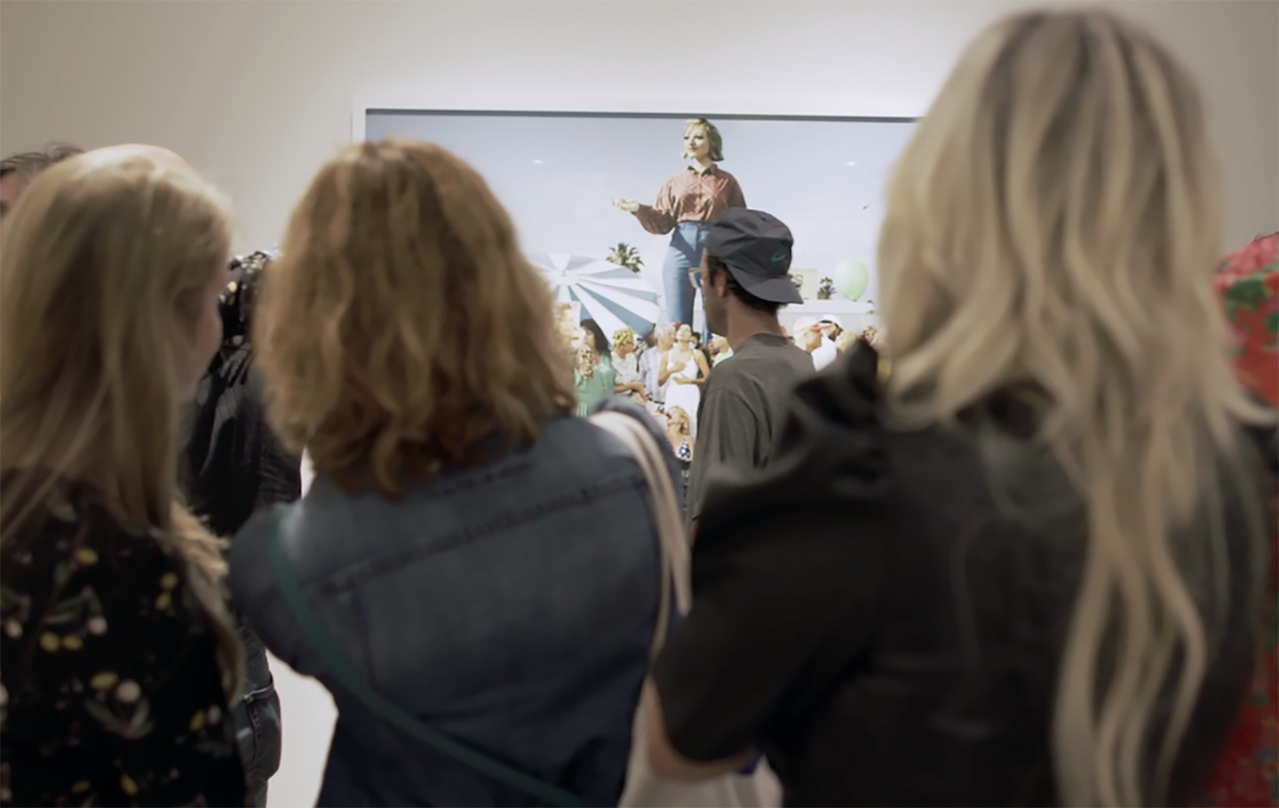 Crowd viewing a gallery photo