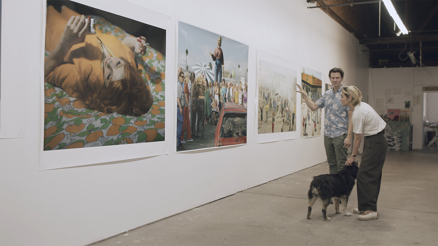 People viewing prints in a gallery