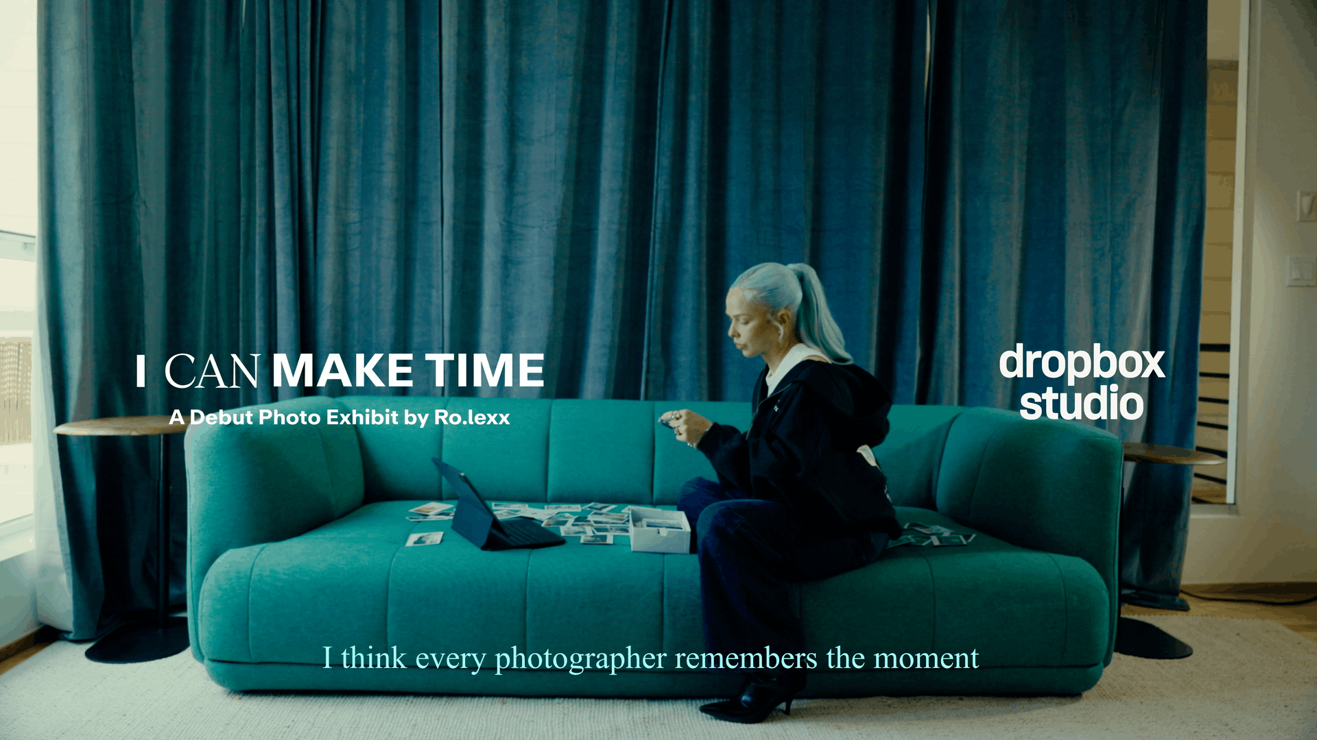 Ro.lexx reviews printed photos beside laptop for “I Can Make Time” exhibit 