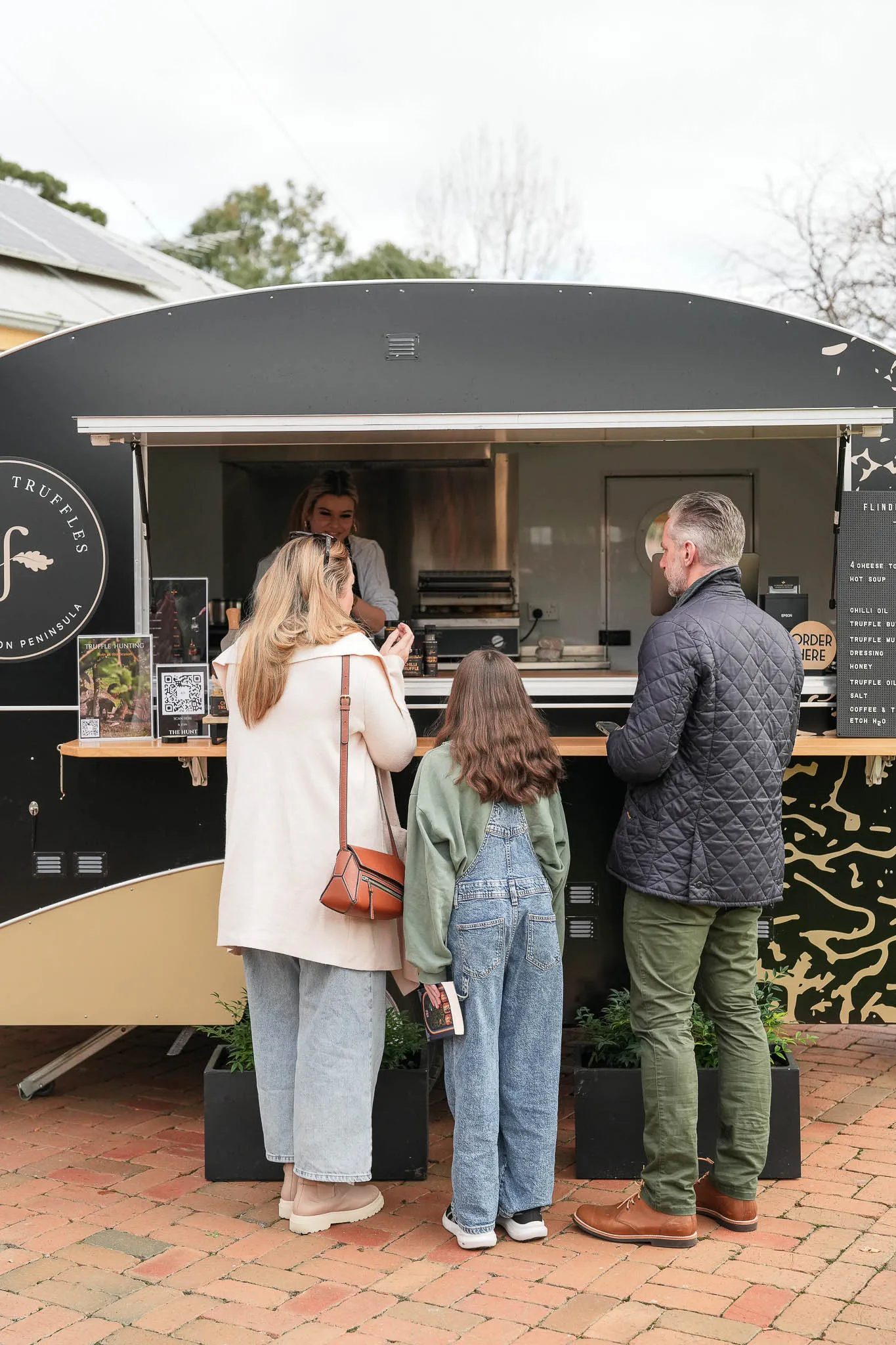 Flinders Truffles Van serving truffle-based dishes at an outdoor market.