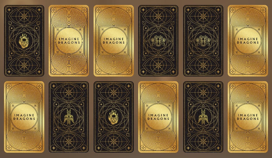 Interior shot of a modern stadium with stone pillars, a Gillette Gaming Alliance sign, and a bed with a striped blanket in the foreground.