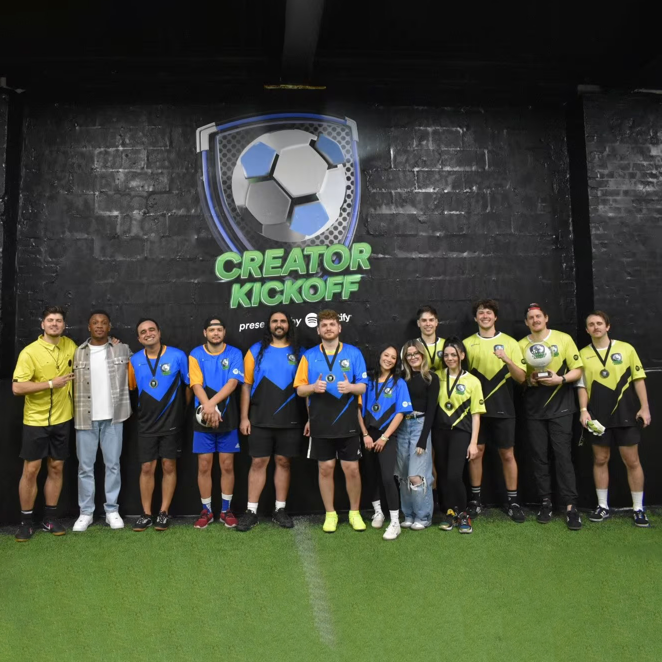 Pair of black and blue sneakers with cartoon character and spiral designs on the sides.