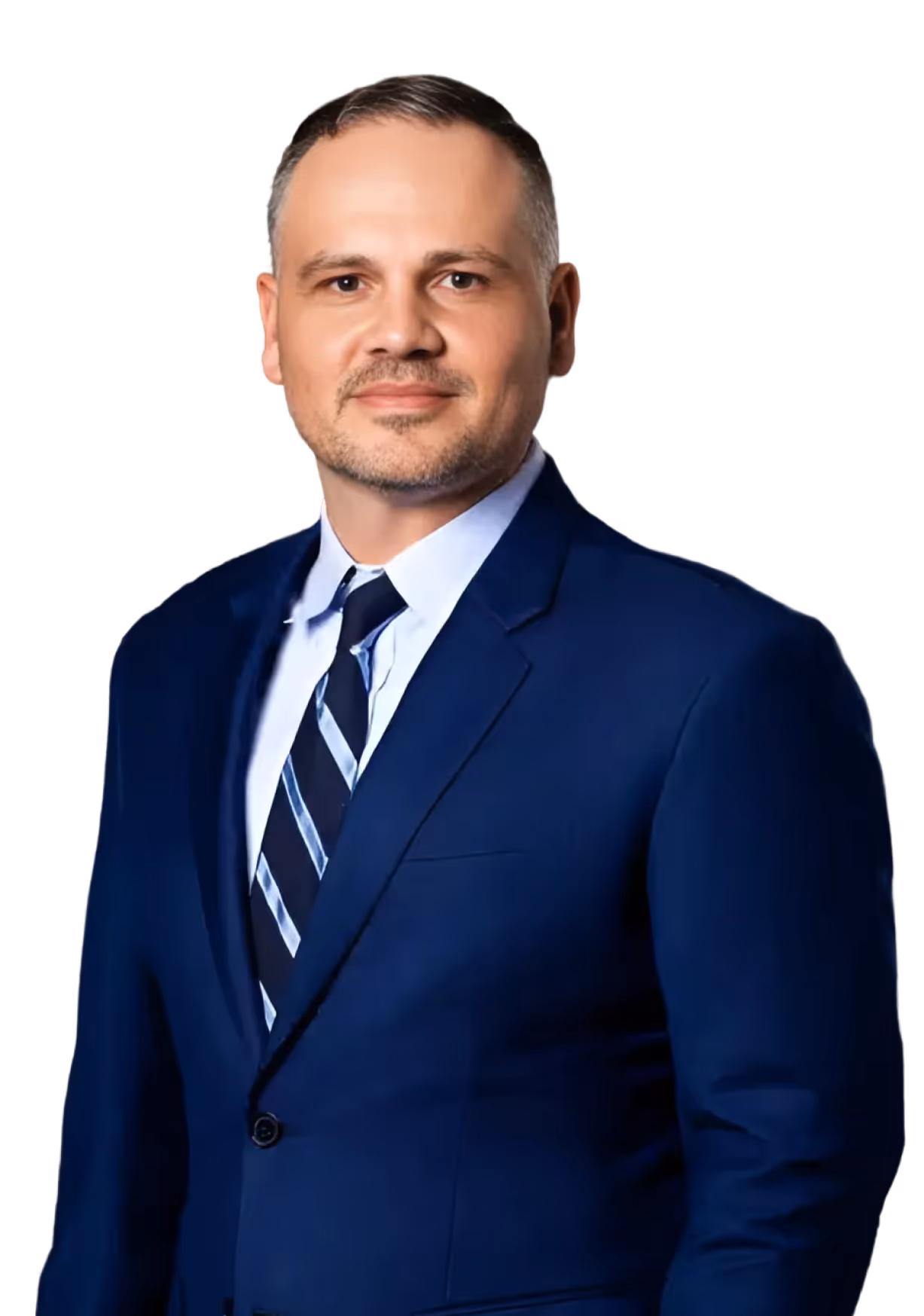 Smiling man in a blue suit and striped tie against a black background.