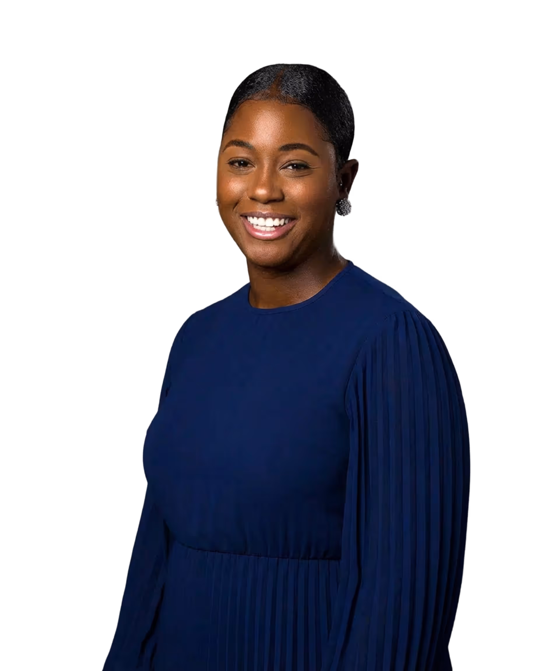 Smiling woman with neatly styled hair wearing a blue pleated dress against a black background.