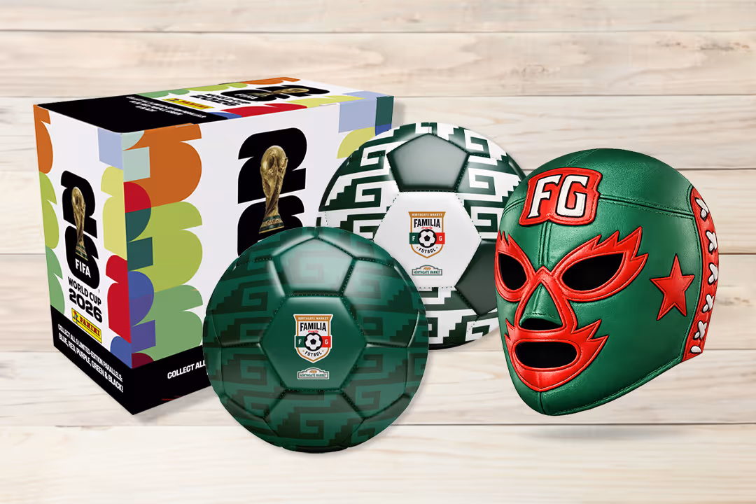 Three seasoned shrimp cooking in oil in a black pan.