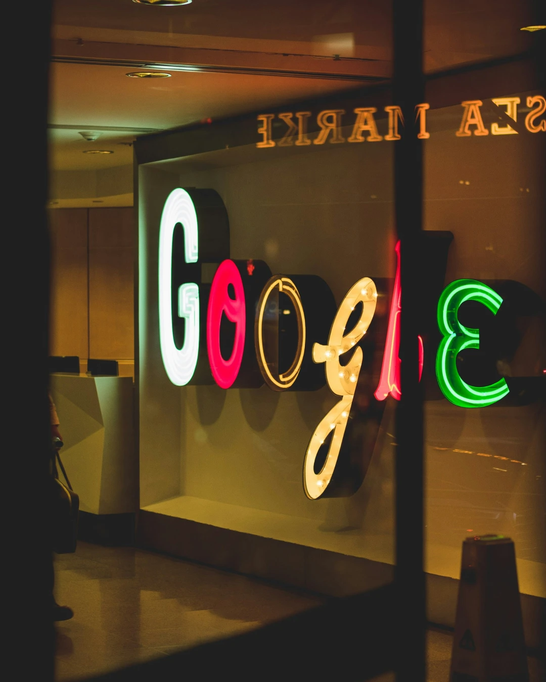 Illuminated Google sign representing search engine optimisation, organic search visibility, and SEO strategy for businesses.