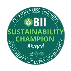 Circular green badge with BII logo and text reading 'Sustainability Champion Award, Keeping Pubs Thriving in the Heart of Every Community'.