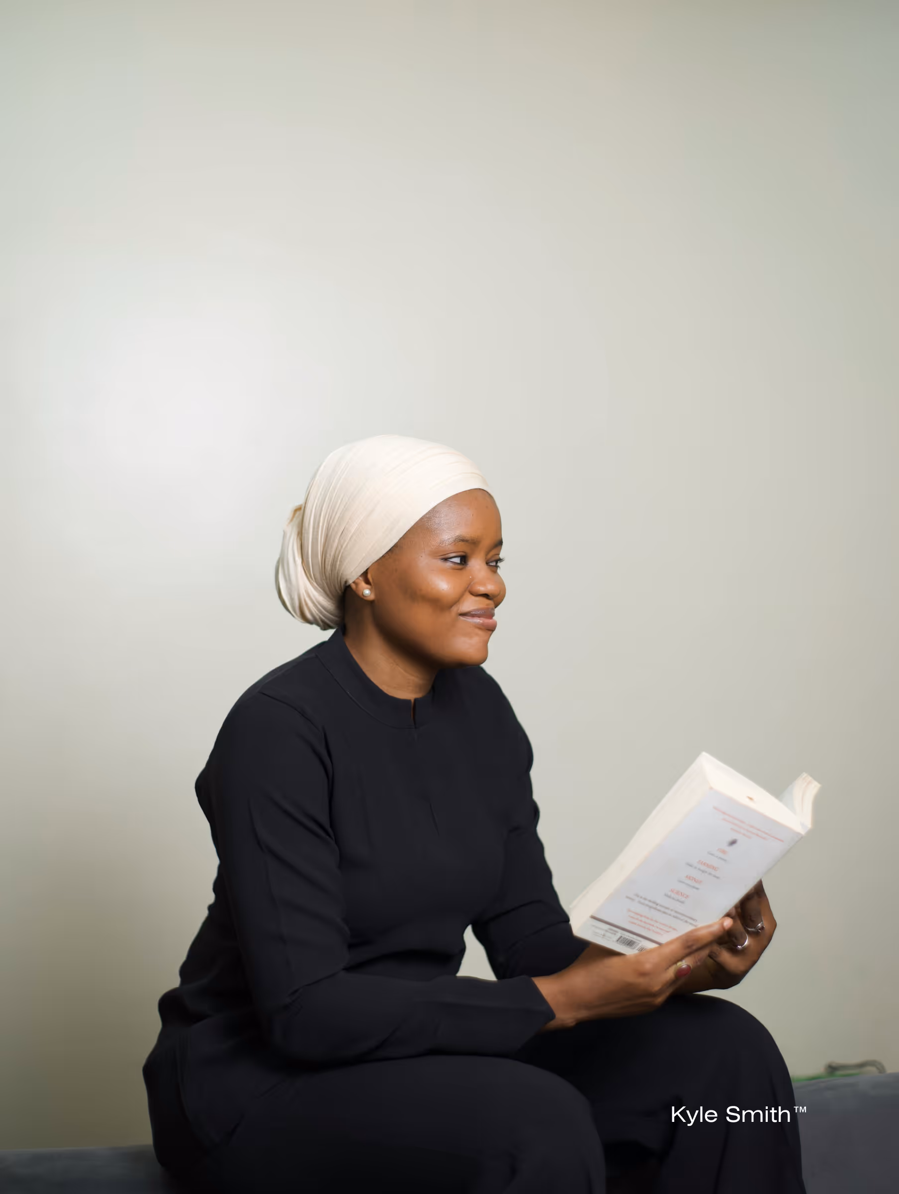 A woman focused on reading, representing the deep research and investigative journalism required to simplify complex technical whitepapers.