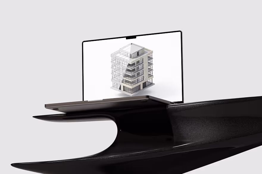 Laptop displaying a 3D architectural model of a multi-story building on its screen, placed on a sleek black modern stand.