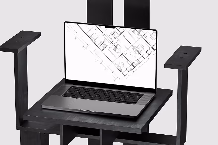 Open laptop displaying an architectural floor plan on its screen, placed on a black wooden stand or table frame.