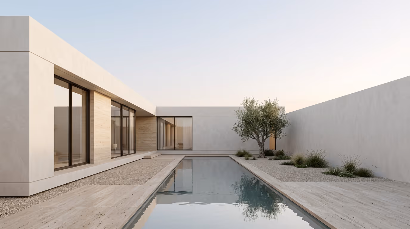 Minimalist modern house with large windows, a reflecting rectangular pool, and a small garden with an olive tree and grasses.