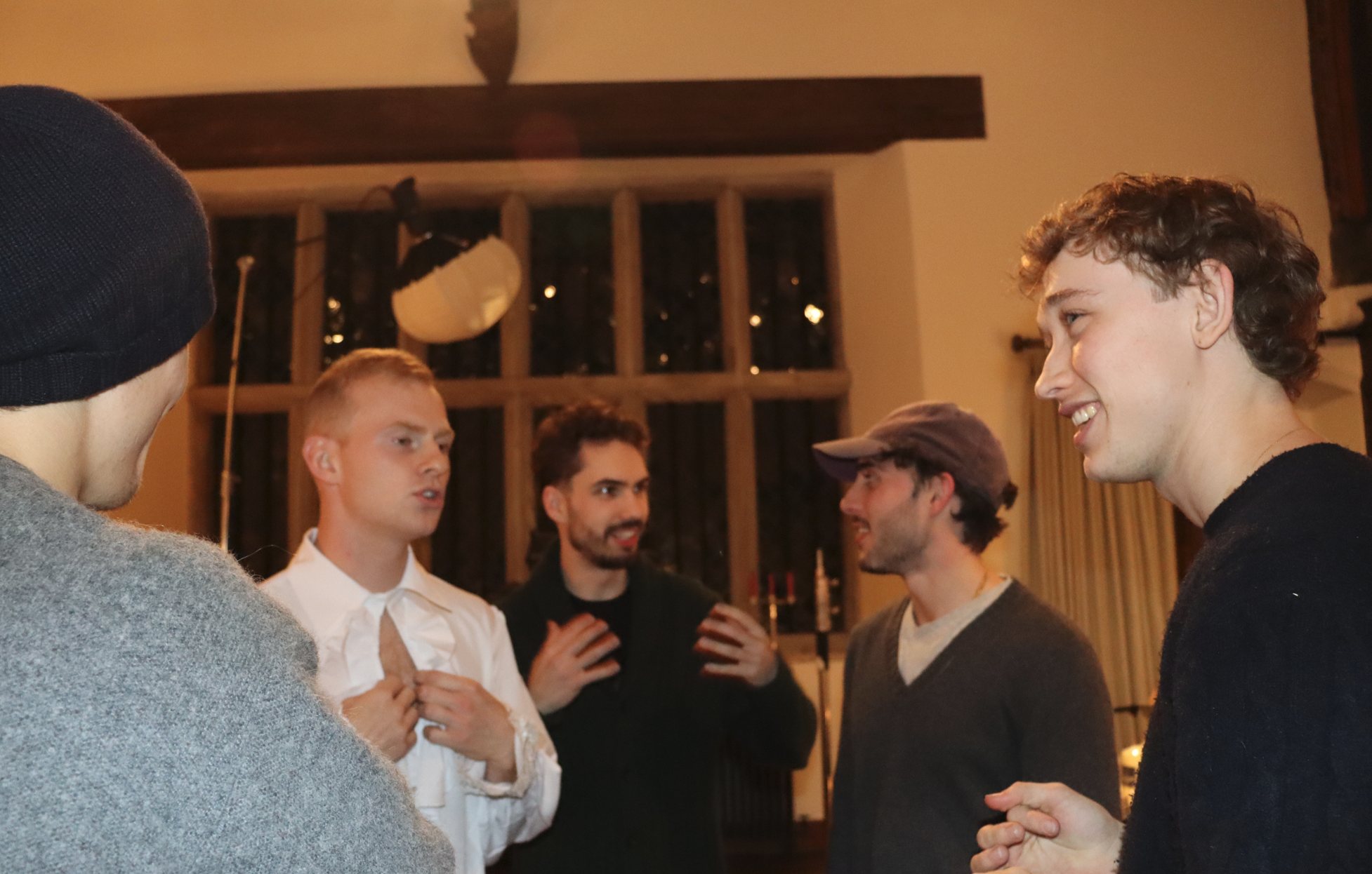 Crew and cast talking between takes on location