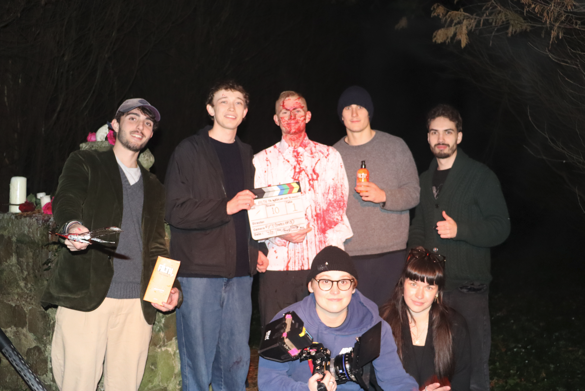 Night shoot crew group shot with clapperboard