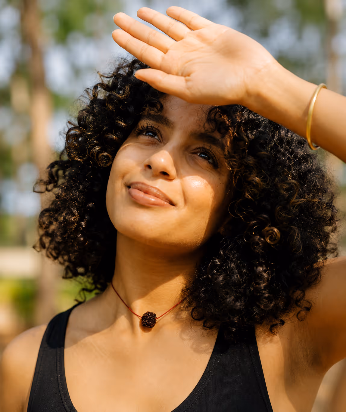 Woman enjoying the sun, feeling her best thanks to early preventive care