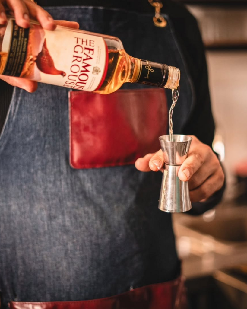 Skqutz logo with stylized tree and lettering.