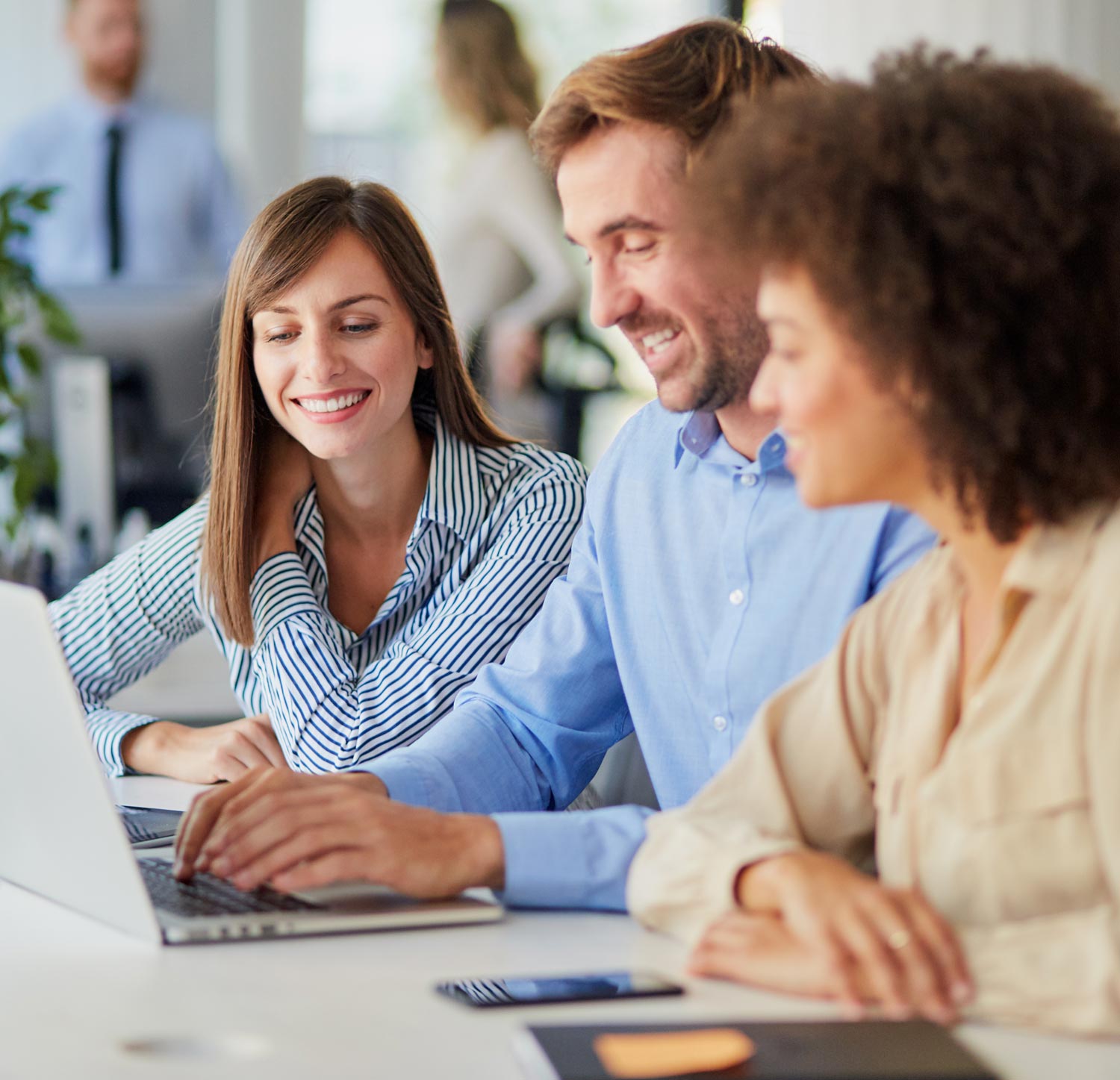 Sales team in coaching conversation