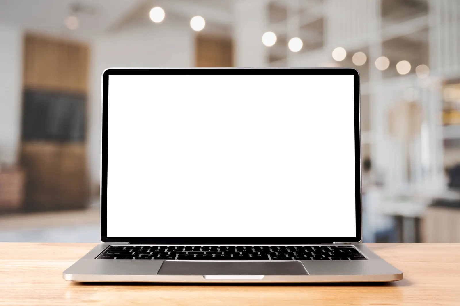 A laptop on a desk showing the FAB Apparel rewards page