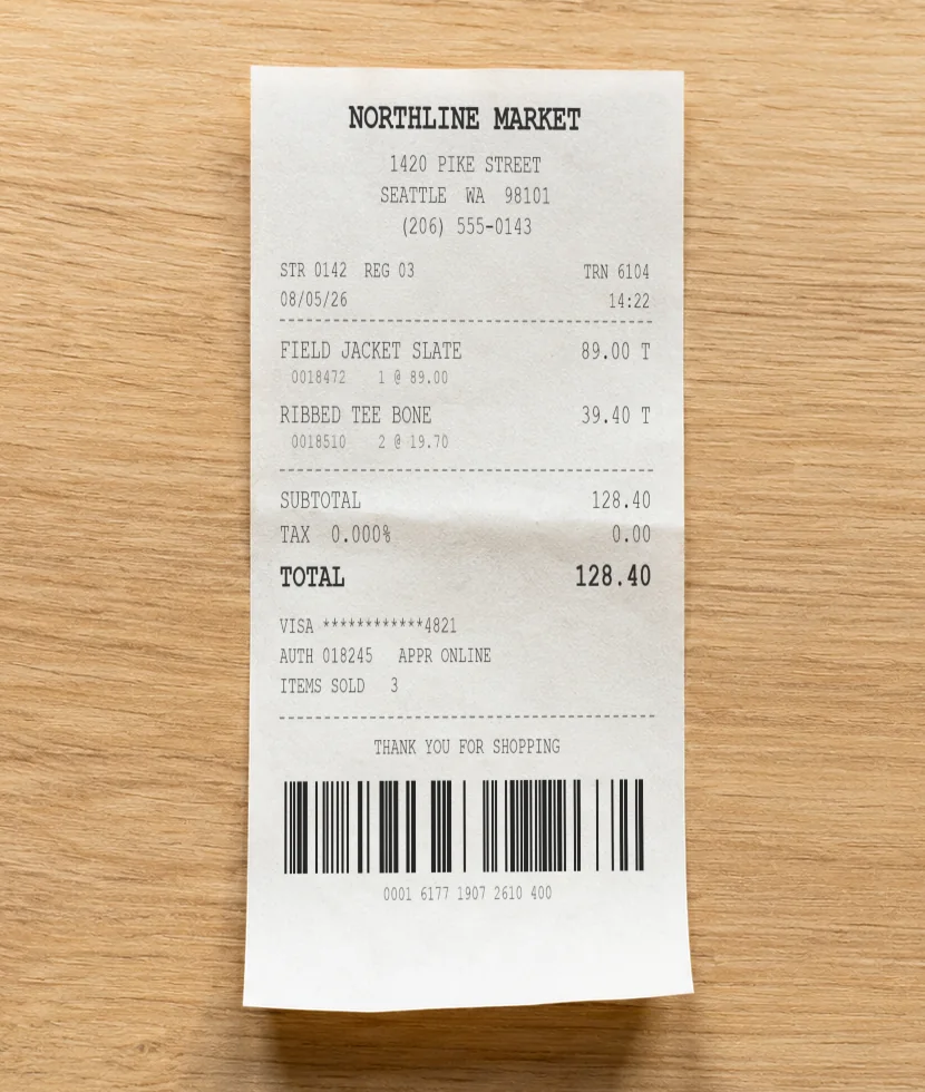 A paper receipt from Northline Market showing two purchased items and a $128.40 total