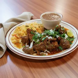 Plate with birria tacos topped with cilantro and onions, served with a side of yellow rice and a cup of consommé.