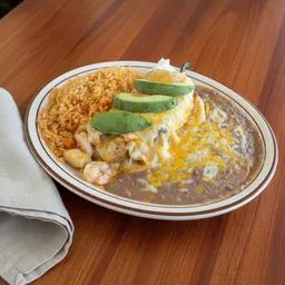 Plate with refried beans, Mexican rice, shrimp covered with melted cheese and avocado slices on top.