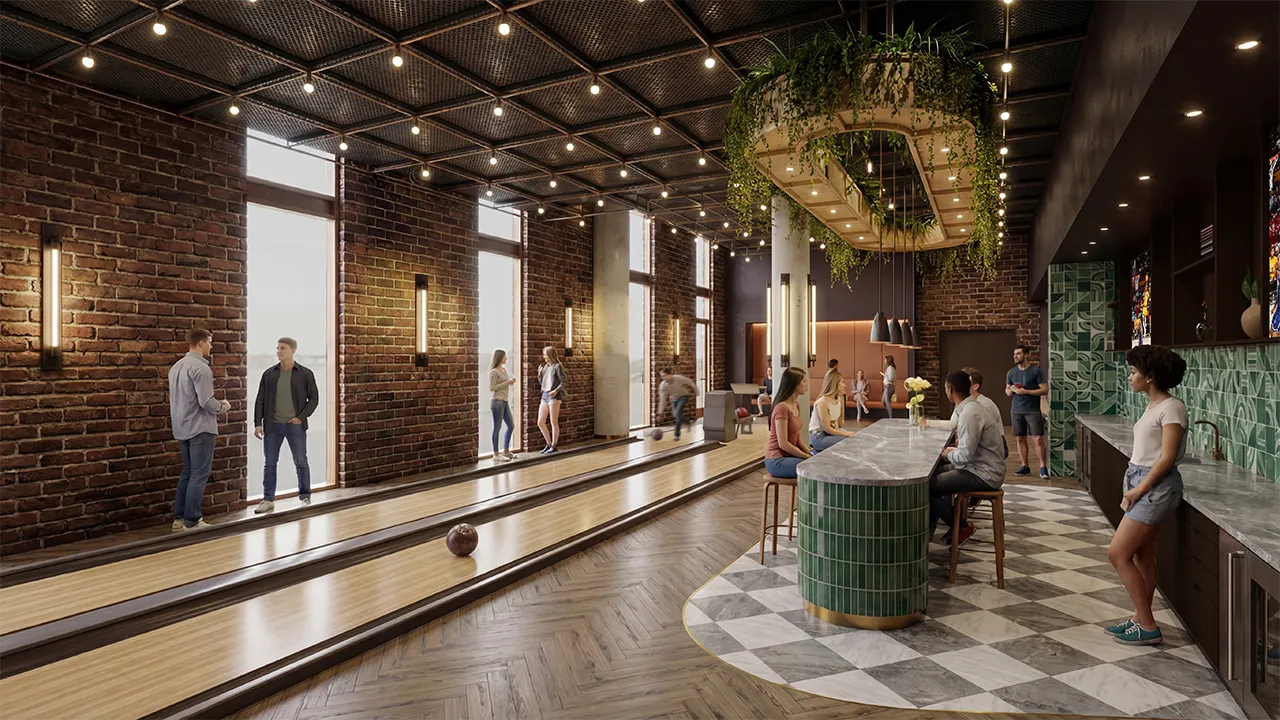 Modern bowling alley with brick walls, people playing and socializing around a green-tiled bar.