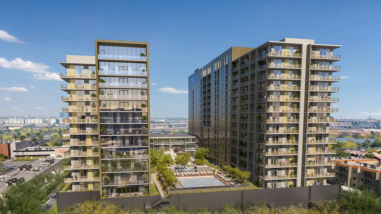 The Revelry, a modern multi-story residential building with balconies and outdoor pool.
