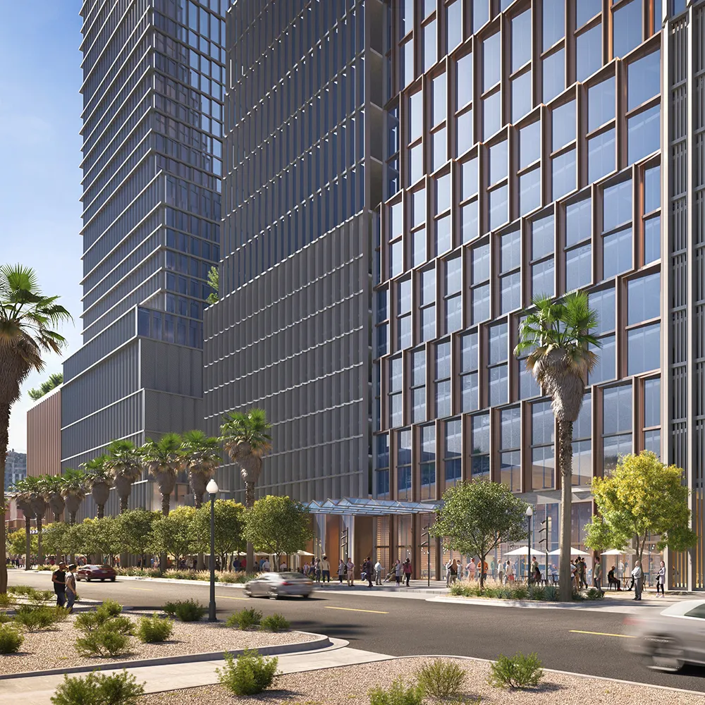 Street of Arro with tall glass buildings, palm trees, pedestrians, and moving cars on a sunny day.