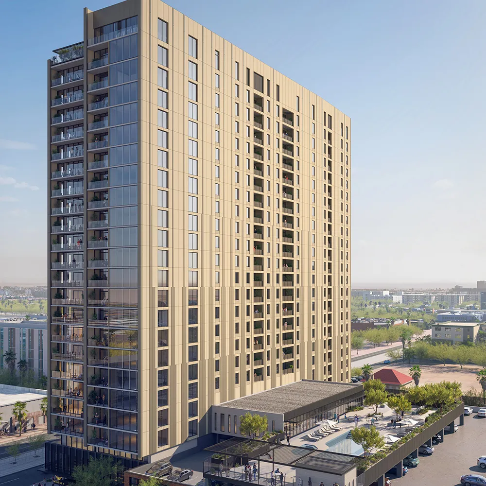 Tall modern beige apartment building with balconies, rooftop pool, and outdoor seating area.