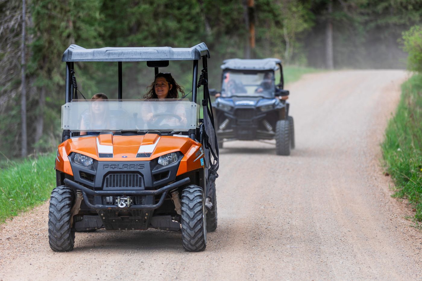 2 side-by-sides riding on trail near Wickiup