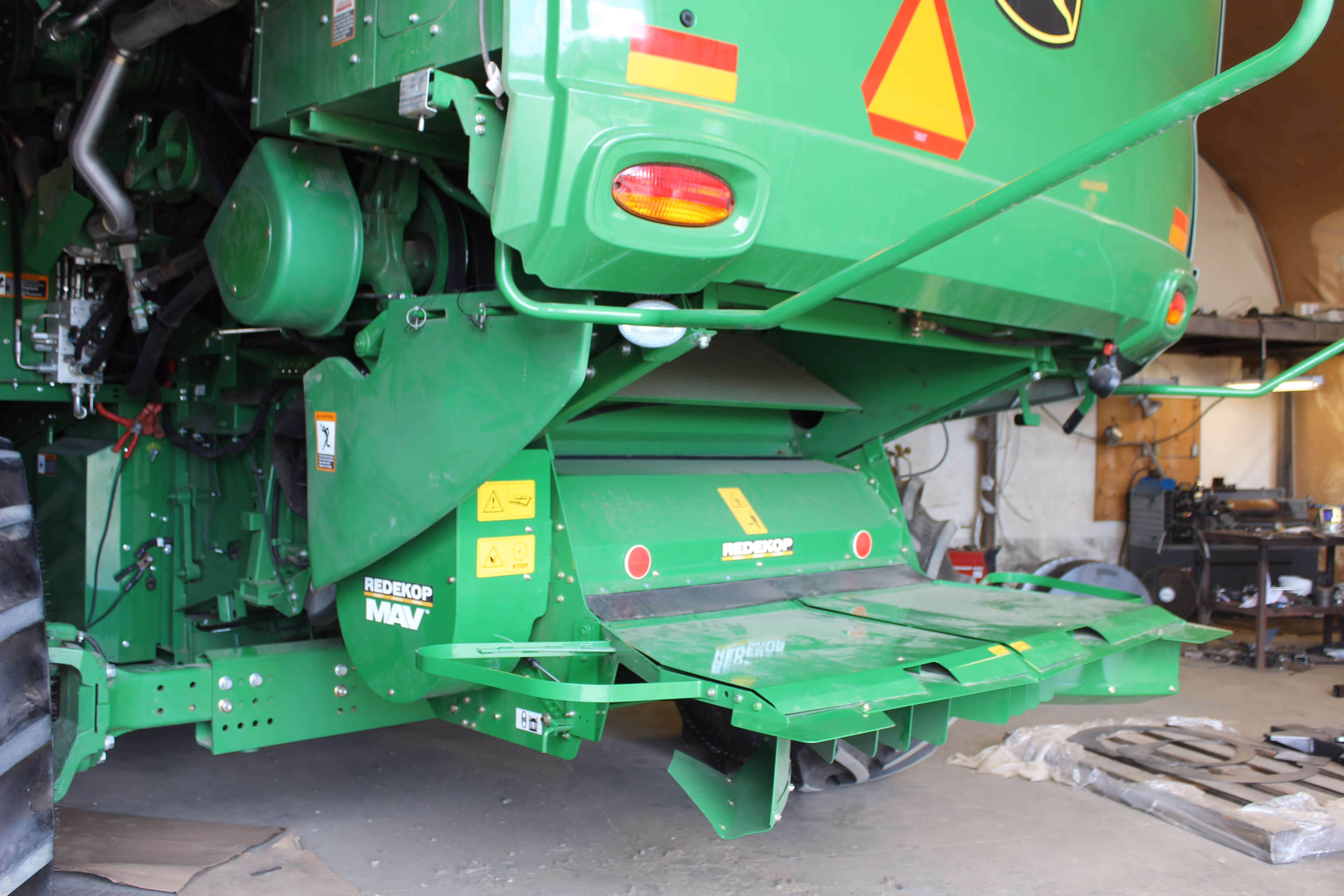 John Deere S Series combine with Redekop MAV straw chopper