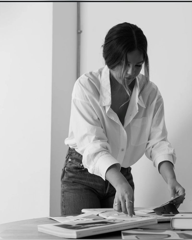 Black and white photo of a person in a leather jacket facing away with a blurred shadow effect.