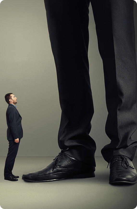 Small person standing beside a much larger person
